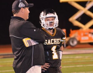 Trent Crossan talking with Sachem coach Dave Falco.